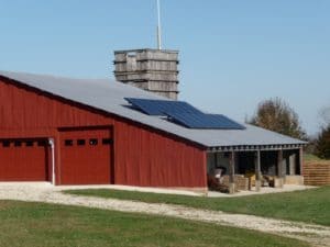 The solar panels on the roof of the Belshe farm in Cuba, Mo. produce clean, renewable electricity at a reasonable cost.